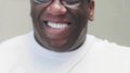 David Brown, a Black man with glasses and a white shirt.